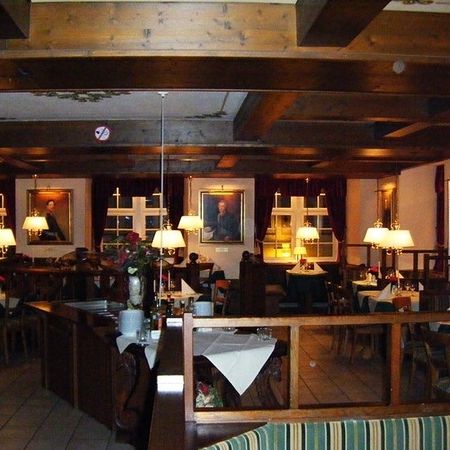 The cosy Regentenstube with stylish tables and chairs, ideal for a relaxed meal